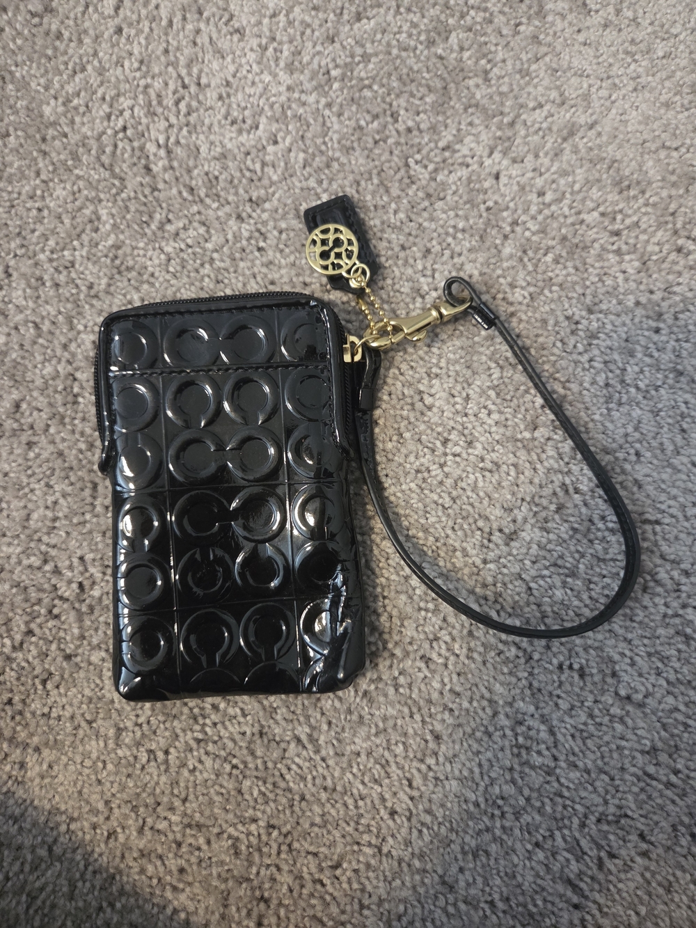 Coach Black Patent Wristlet Phone Case with Gold Accent